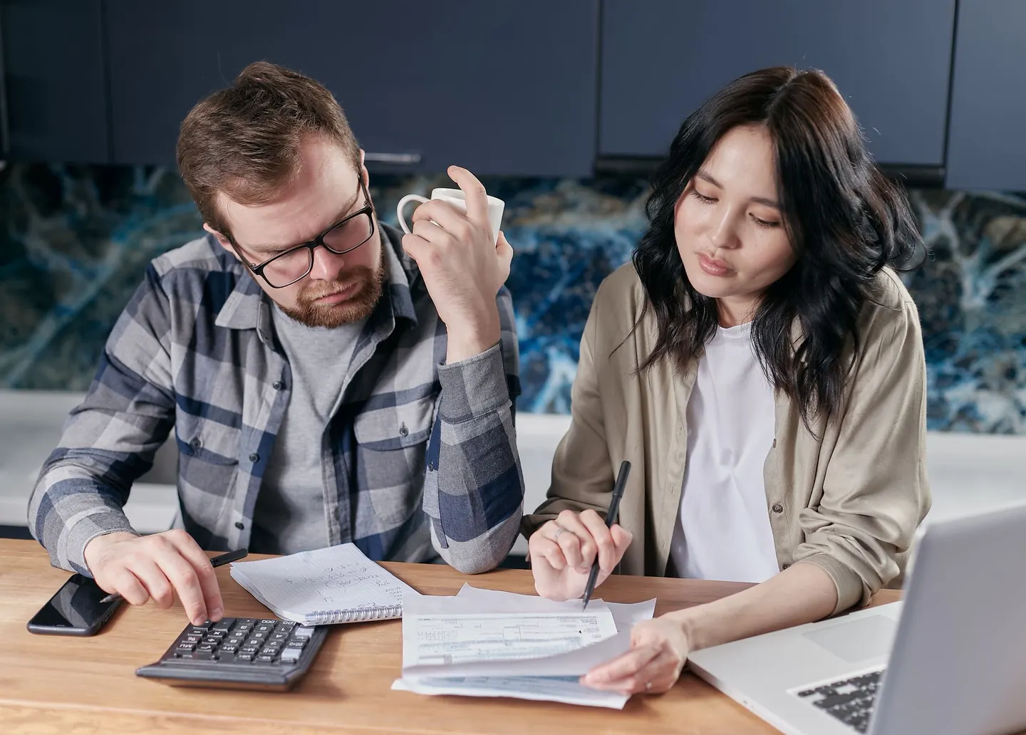 A couple reviewing household bills together