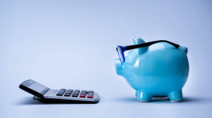 Piggy bank with glasses and calculator